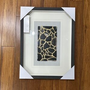 Elegant Framed Art with Black and Gold Details